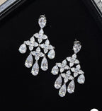 Moissanite chandelier earrings with cascading pear and marquise cut stones by Damani Jewels