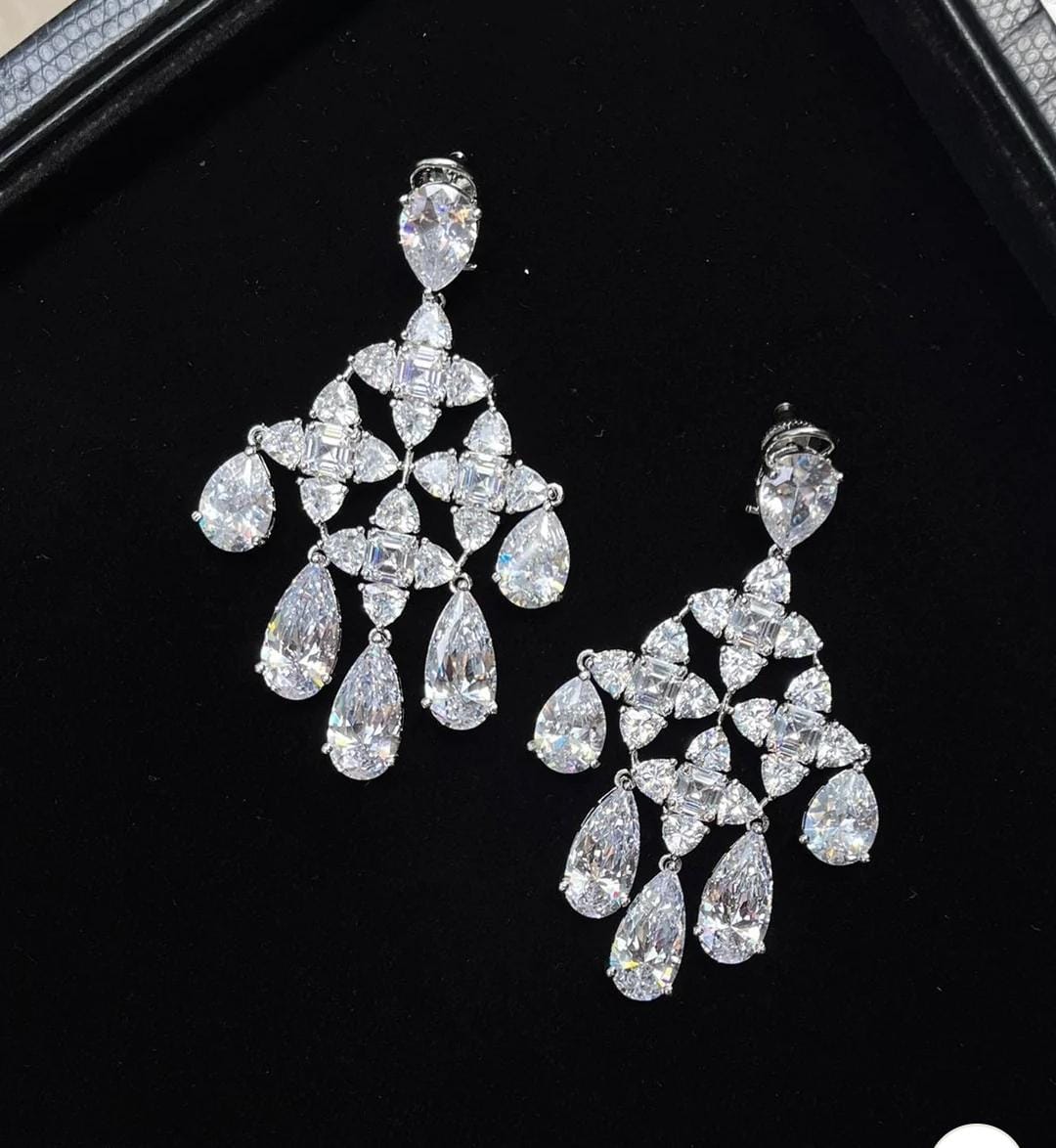 Moissanite chandelier earrings with cascading pear and marquise cut stones by Damani Jewels