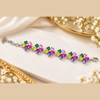 Multicolor flower bracelet featuring pink, green, yellow and purple stones