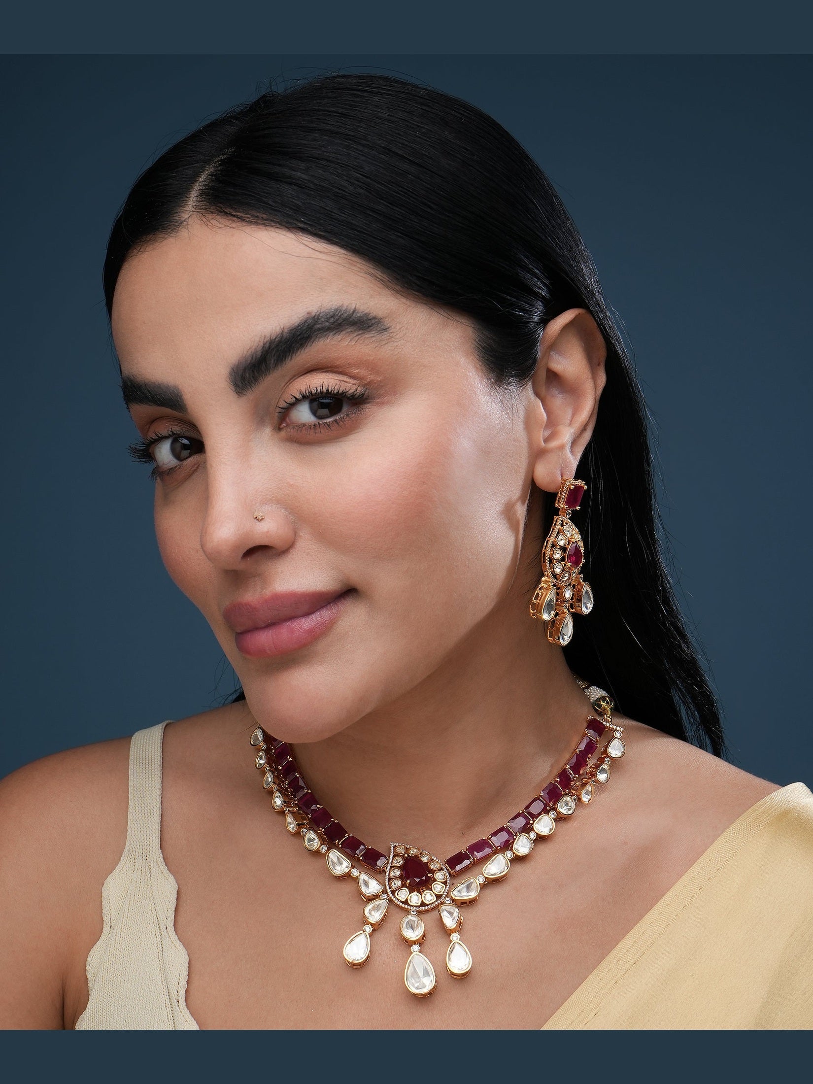 Traditional gold kundan choker necklace set with green bead detailing, matching earrings, and adjustable dori closure for women.