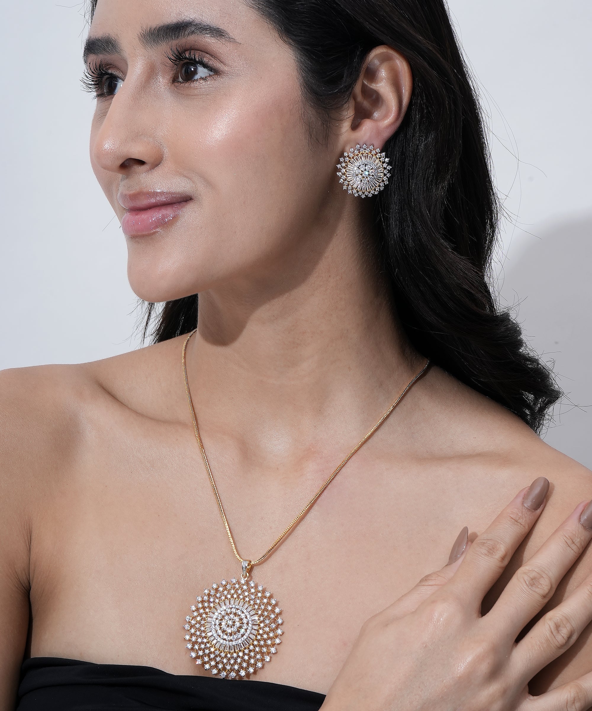 A stunning gold-plated round pendant set designed with premium CZ stones.