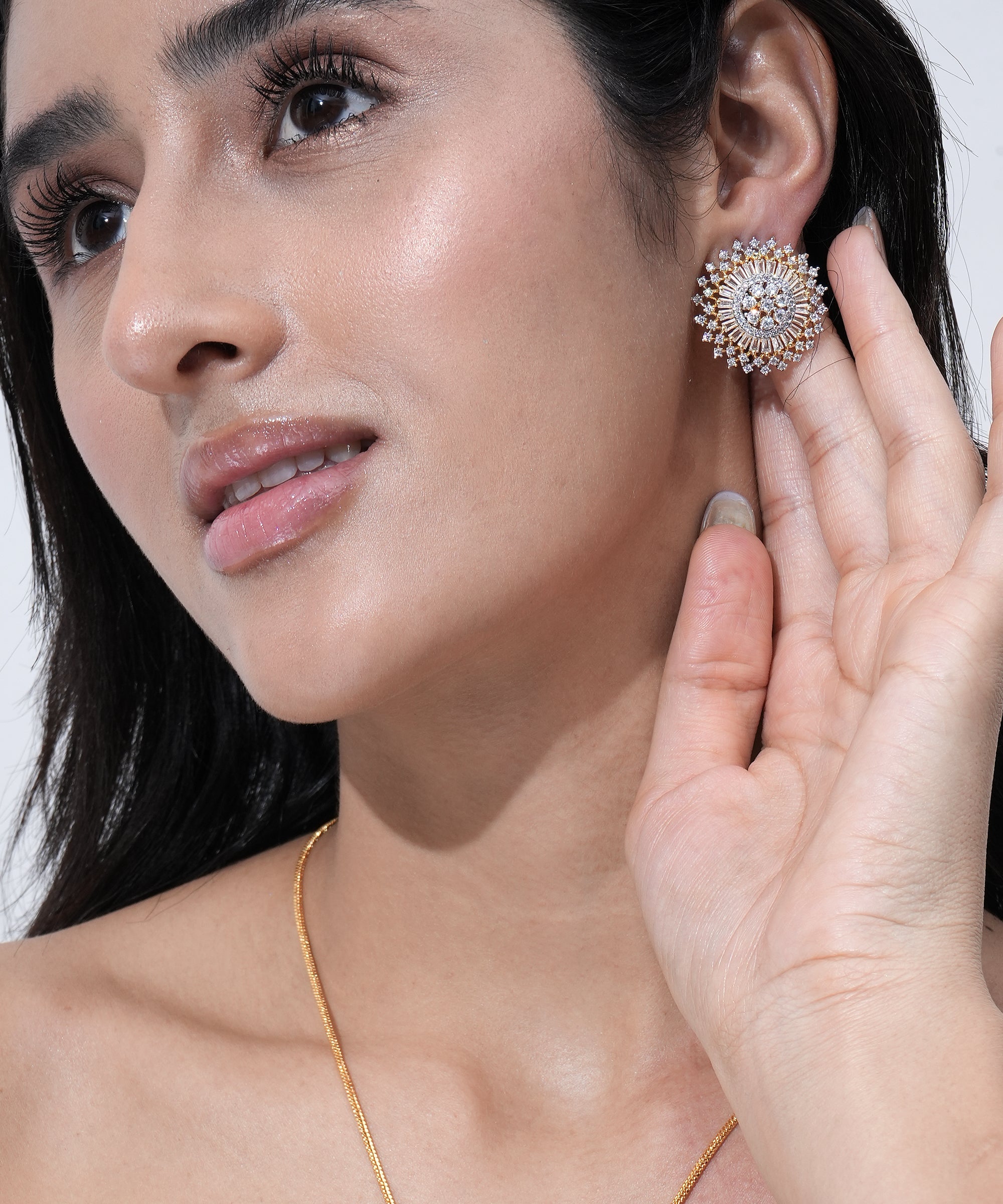 A stunning gold-plated round pendant set designed with premium CZ stones.