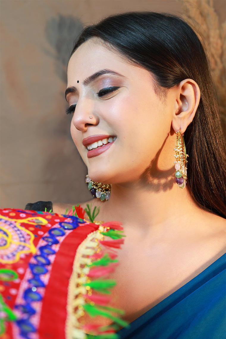 Model wearing Damani Jewels multicolor kundan chandbali hoop earrings – bridal festive jewelry.
