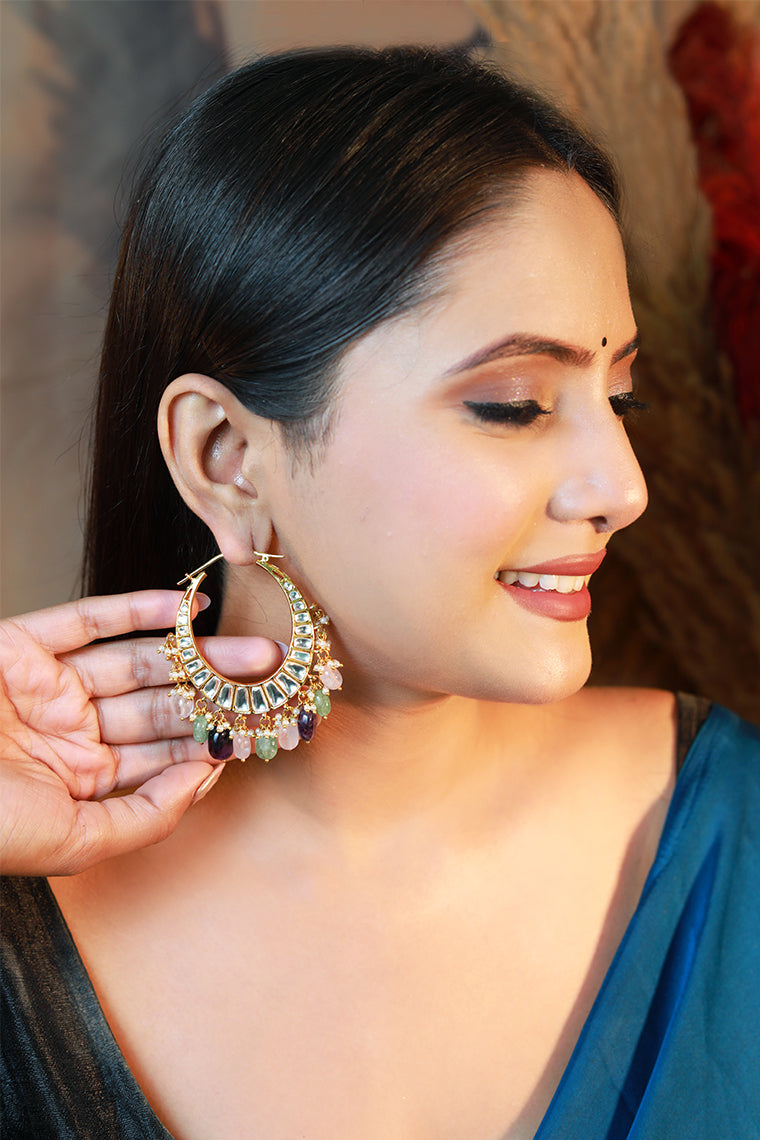 Model wearing Damani Jewels multicolor kundan chandbali hoop earrings – bridal festive jewelry.