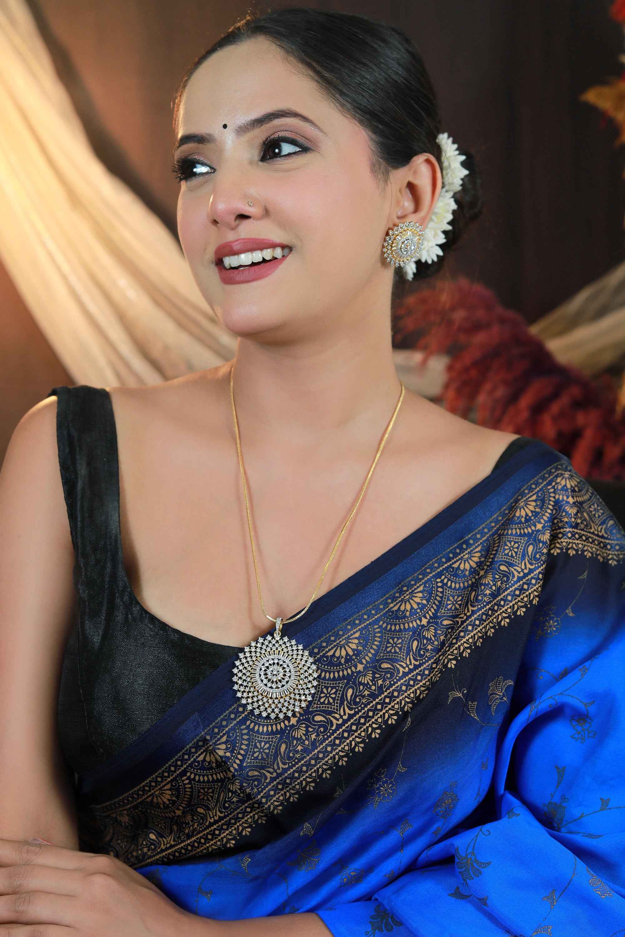 A stunning gold-plated round pendant set designed with premium CZ stones.