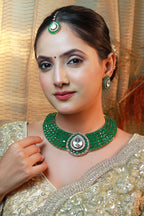 “Emerald green statement choker necklace with rectangular stones and a large pear-shaped polki centerpiece.”