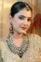 Bridal Kundan necklace set with emerald beads, matching earrings and maang tikka – Indian wedding jewellery.”