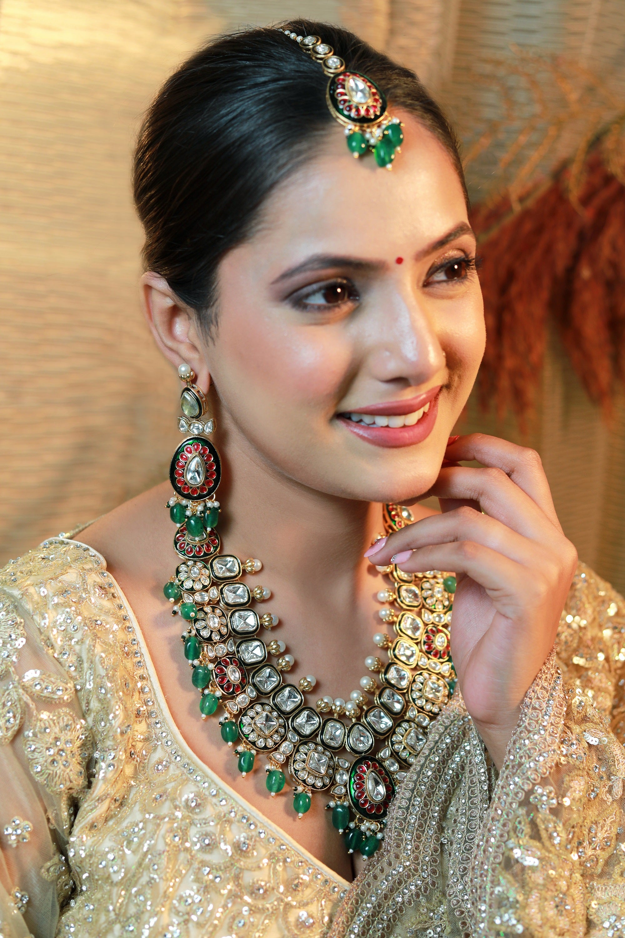 Bridal Kundan necklace set with emerald beads, matching earrings and maang tikka – Indian wedding jewellery.”