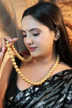 “Swarovski golden pearl beaded mala necklace for women.”