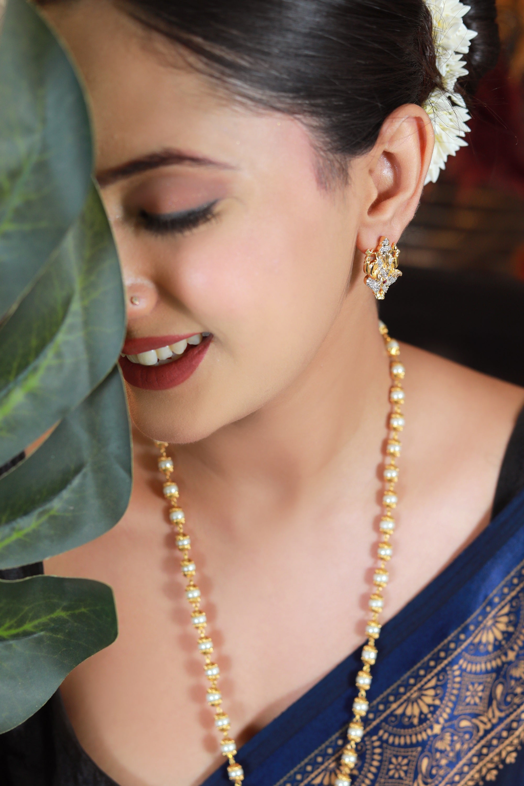 “Lord Ganesha gold-tone pendant necklace set with matching earrings – Damani Jewels”