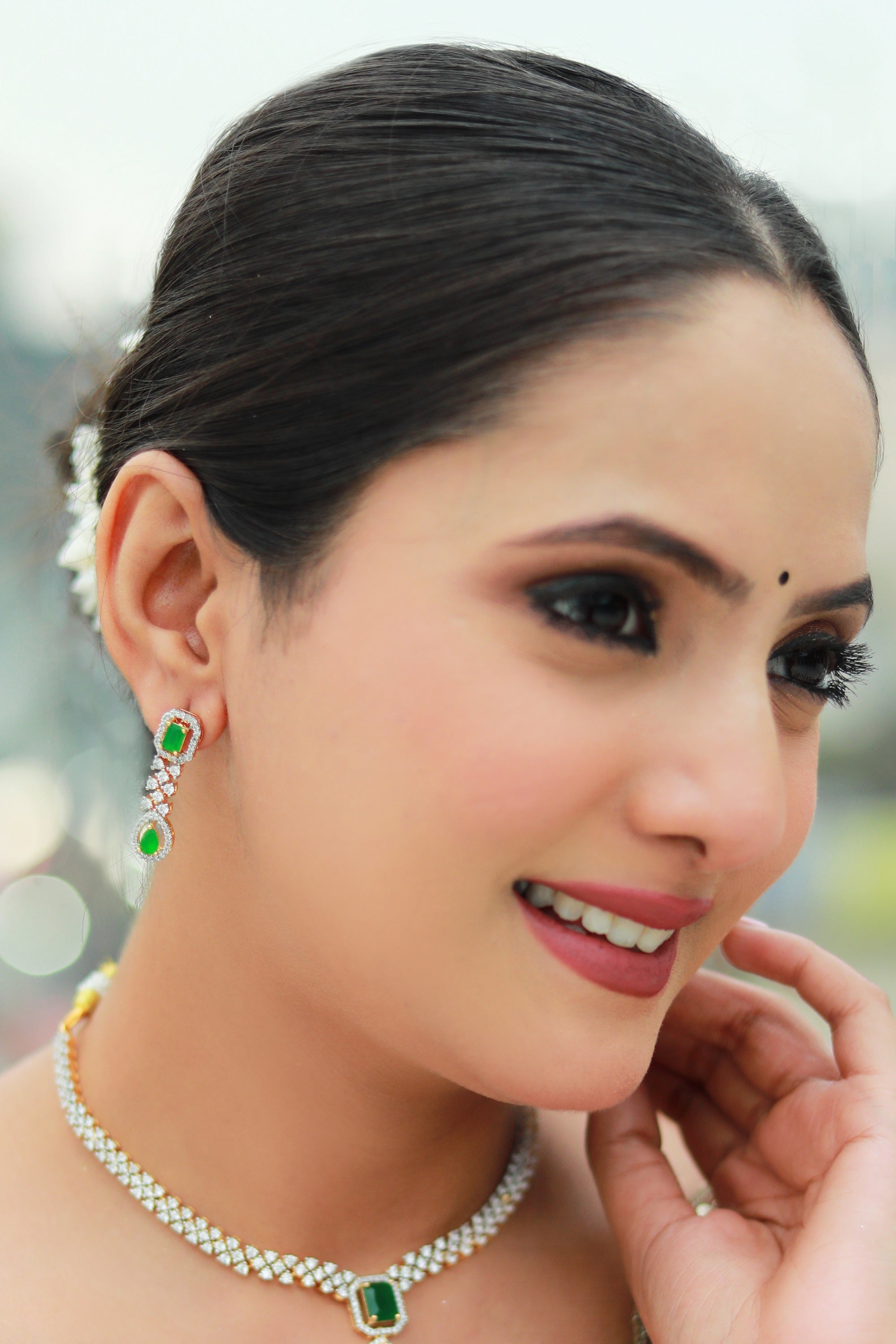 “Emerald green pendant necklace set with diamond CZ stones and matching earrings – Damani Jewels.”