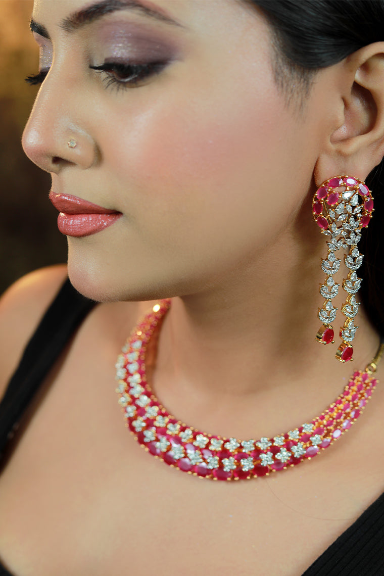 Model wearing Damani Jewels red stone bridal necklace set with matching long earrings – premium wedding jewelry.