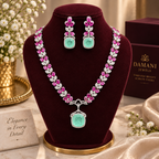 Damani Jewels pink and mint green statement necklace set with matching earrings
