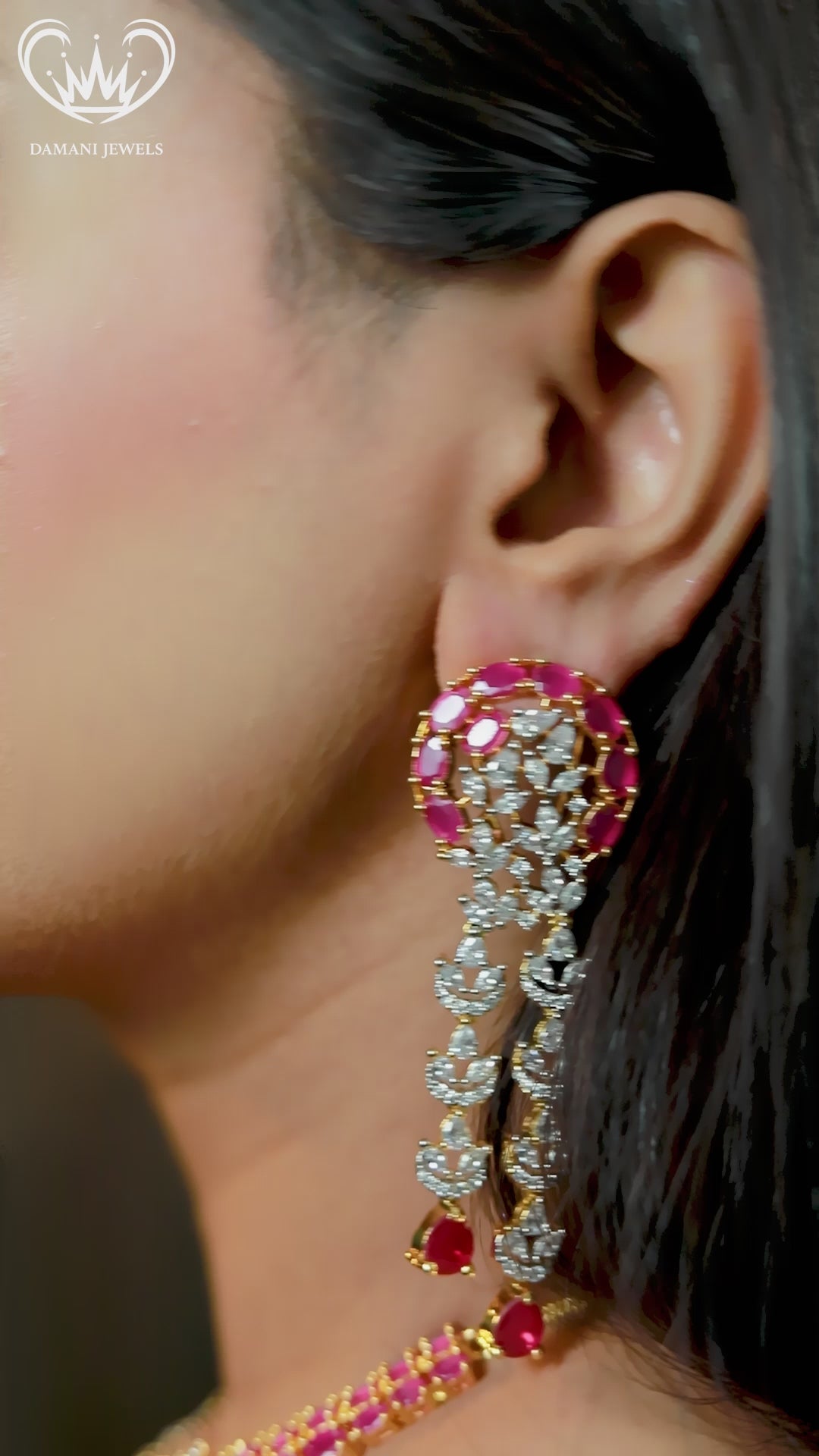 “Gold-plated triple-layer ruby necklace set with CZ floral stones and matching long earrings.”