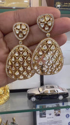 Women's gold-tone teardrop drop earrings styled for a festive or wedding occasion