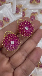 Close up of pink marquise stone floral statement earring