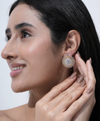 Gold-plated American Diamond sunburst stud earrings with sparkling round and baguette-cut stones.