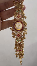 Designer festive bracelet watch with ruby and emerald color stones