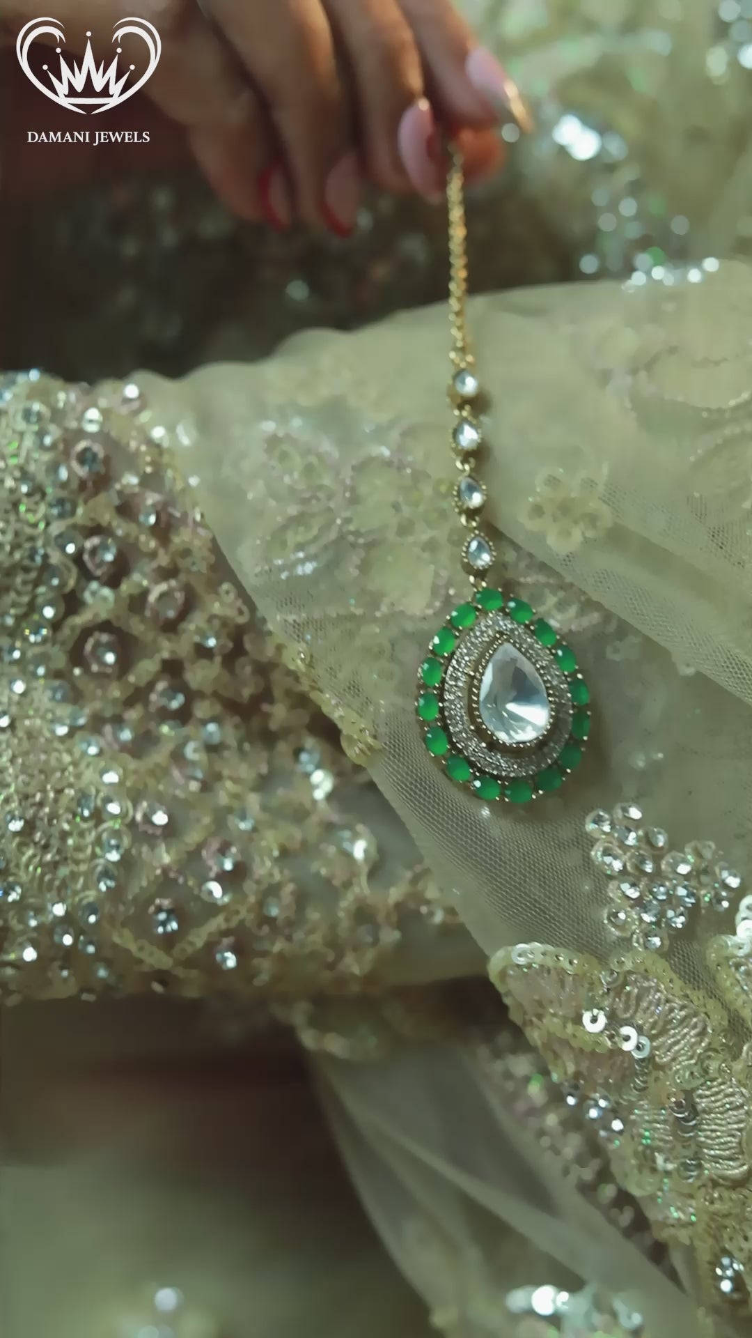 “Emerald green statement choker necklace with rectangular stones and a large pear-shaped polki centerpiece.”